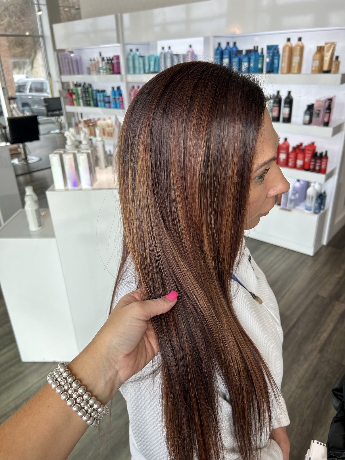 Glossy red brunette color, sleek and straight